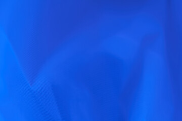 Blue textile fabric. Selective focus. Top view.