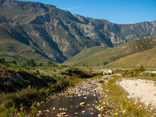 Fototapeta na wymiar Gobos River with Riviersonderend Mountains in background. Greyton. Western Cape. South Africa