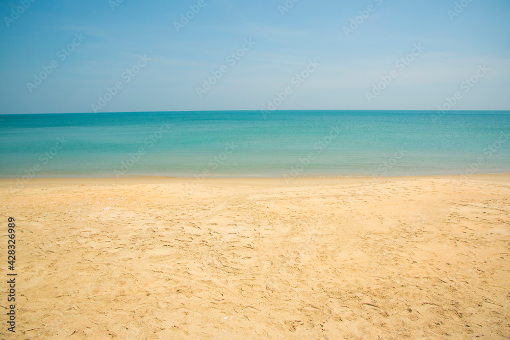 Wall mural beach and sea with sky and clouds