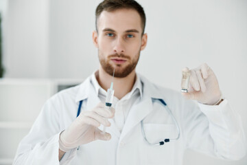 professional doctor holding a syringe in his hand laboratory vaccine health chemical liquid laboratory assistant