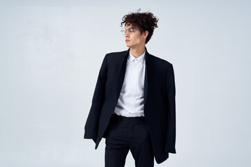 business man in suit glasses curly hair fashion studio