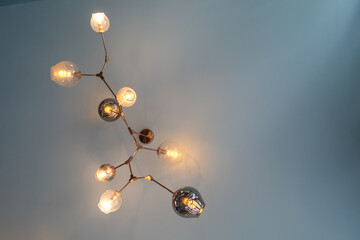 Stylish lights on gray ceiling