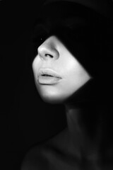 Fototapeta premium young woman with shadow on the face