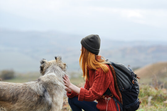 woman hiker next to dog mountains nature fresh air travel