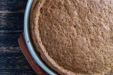 Home-made onion quiche, a baked cream and egg pie topped with cheese and capsicum