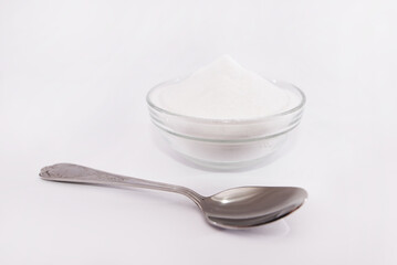 baking soda and spoon on white
