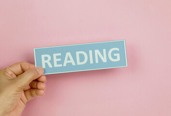 hand holding colorful sign of English learning skills