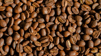 Roasted coffee beans background, arabica beans, top view, texture, close up, seed, Horizontal orientation, copy space