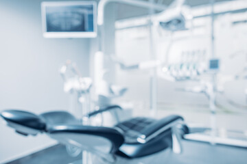 Defocused background and copy space image of dental office with dentist chair and equipment - obrazy, fototapety, plakaty