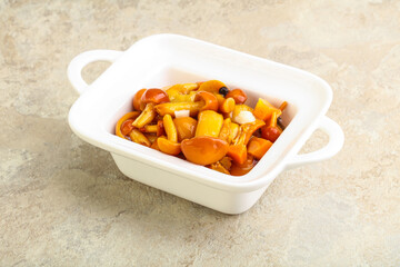 Marinated pickled honey mushrooms in the bowl