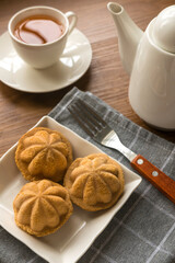 Kueh Bolu or Kuih Bahulu is the Asian traditional food popular in Malaysia and Indonesia.It is a sponge cake baked in special aluminum molds. Serve with a cup of tea.