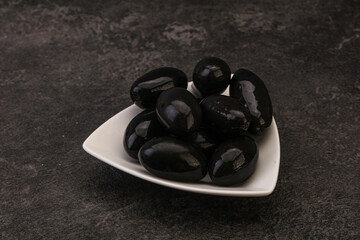 Pickled black olives in the bowl