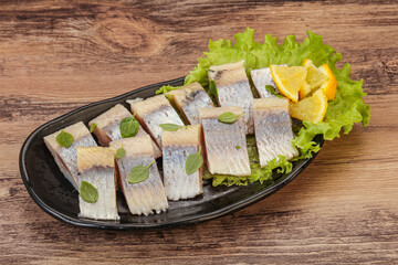 Herring fillet with sliced lemon