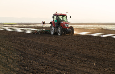 the tractor lays plastic wrap