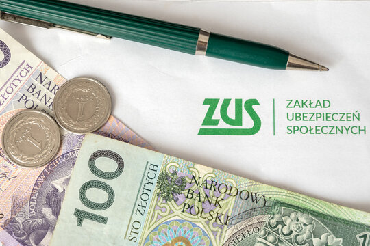 Gdansk, Poland - April 17, 2021: ZUS (National Social Insurance Company) logo on a sheet of paper and polish money