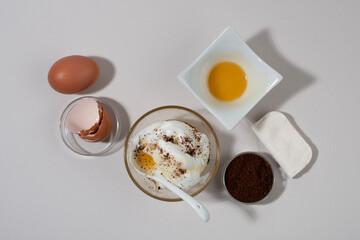 Egg White Face Mask ingredients. Whipped egg white, honey, coffee grounds.