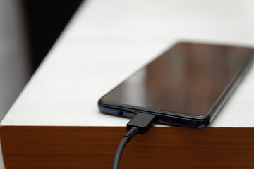 charging a smartphone with cable
