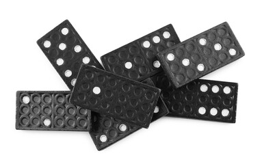 Pile of black domino tiles on white background, top view