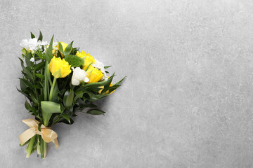 Beautiful bouquet with peony tulips on light background, top view. Space for text