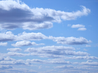White cumulus clouds on a blue sky