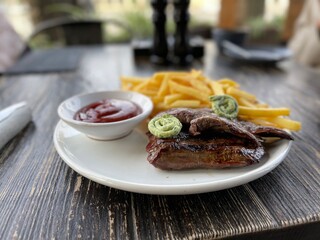 grilled steak with french fries