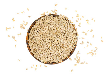 Hullled sunflower seeds pile in bowl on white background.