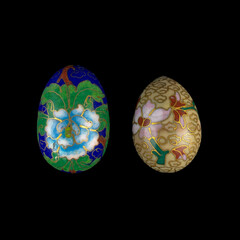 set of wooden Easter eggs with floral patterns on isolated black background