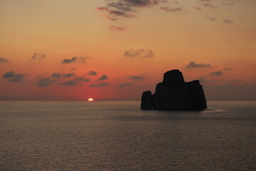Naklejka na ściany i meble super sunset in the south of sardinia in front of the stack of sugar loaf, masua, iglesias 