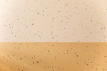 Closeup of a beige background wall with green speckles