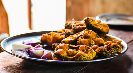 Deep fry fish on a plate ready for serving.