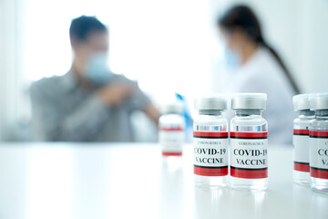 Close up  vaccine bottle is on the table in preparation to be administered