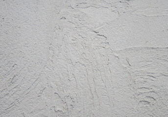 Decorative plaster. Grey wall texture background. Concrete style. Restoration indoors. Maintenance works. Renovation at home.