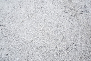 Decorative plaster. Grey wall texture background. Concrete style. Restoration indoors. Maintenance works. Renovation at home.
