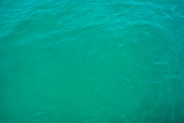 Fototapeta na wymiar Surface texture sea blue emerald green. Turquoise sea water surface background.