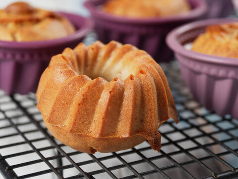 Homemade banana mini bundt cakes on a cooling rack. No sugar added. Healthy toddler food