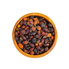 Dried rose hips in wooden bowl, natural vitamin C.