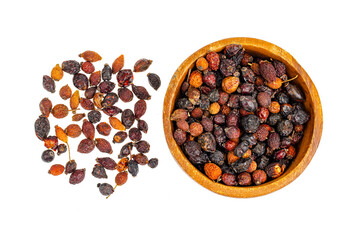 Dried rose hips in wooden bowl, natural vitamin C.