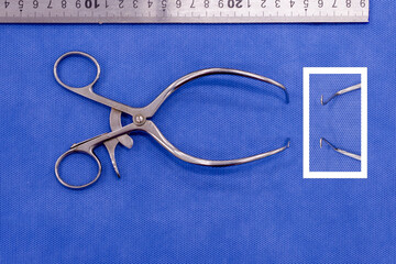 Gelpi retractor on a blue background