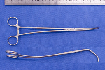 Satinsky forceps on blue background