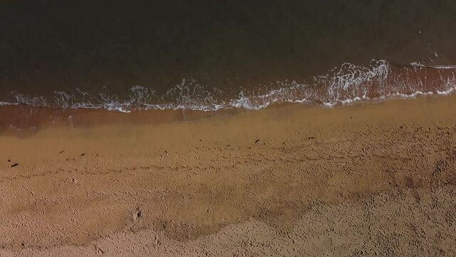 Beach shore waves aerial shot.