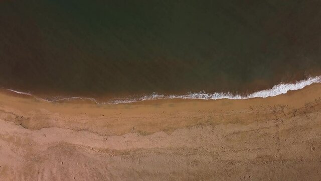 Beach shore waves aerial shot.