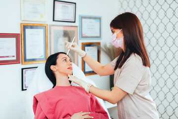 the doctor prepares the patient for aesthetic correction