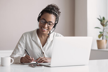 Distance studying, e-learning concept. Woman using laptop computer at home, study online. Student...