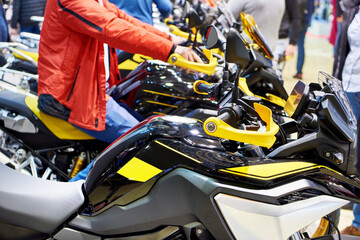Motorcycles and buyers in store