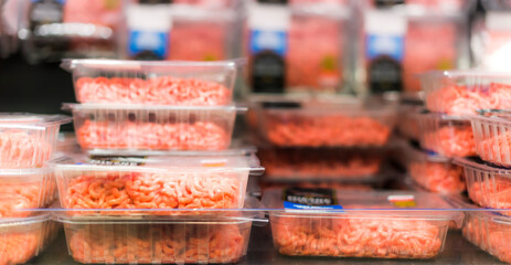 Meat products put up for sale in a supermarket commercial fridge