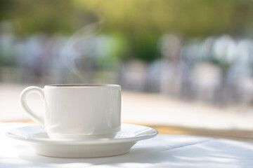 Cup of coffee on table  in terrace 