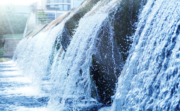 Waste water treatment plant. Modern urban wastewater treatment plant. Cold transparent water of decorative artificial waterfall
