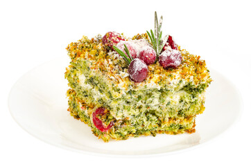 Piece of sweet cake with spinach and cranberries.