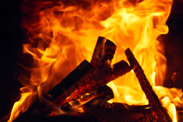 A fire burns in a fireplace, Fire to keep warm. Logs burning in a fireplace