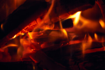 A fire burns in a fireplace, Fire to keep warm. Logs burning in a fireplace